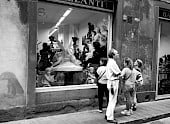 Man ignores female companions window shopping efforts at Bazzanti Art Gallery